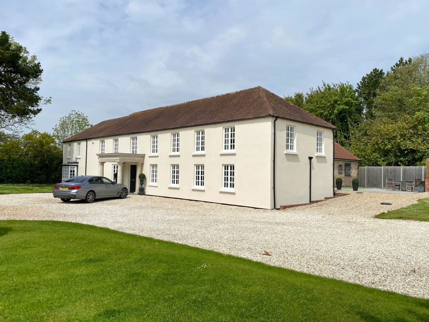 Period country home finished in cream silicone render with gravel driveway